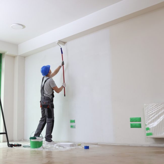 Male,Painter,Paints,House,Wall,With,Roller,Brush.,Decoration,And